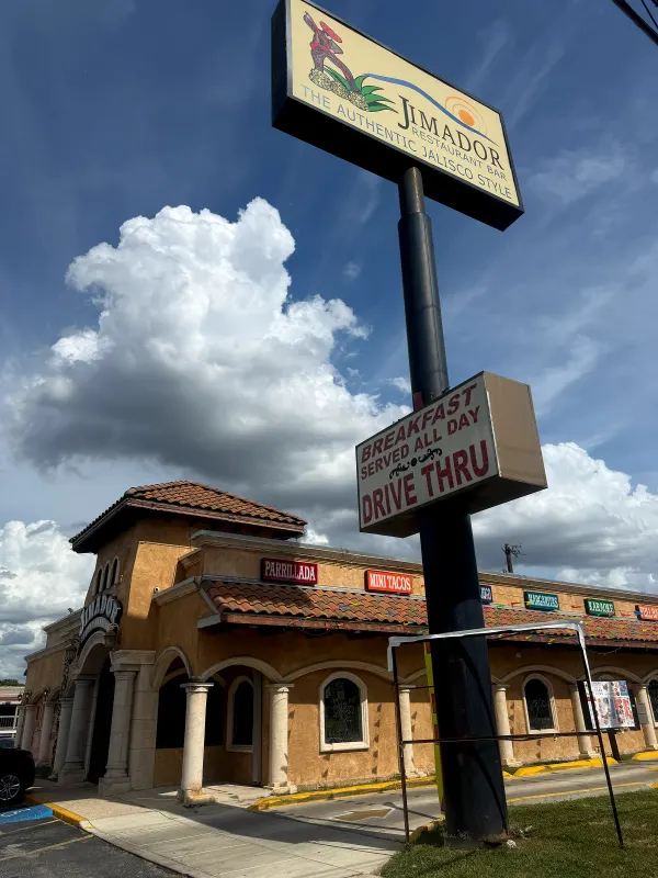 Jimador's pole sign on Vance Jackson with a panel reading DRIVE THRU